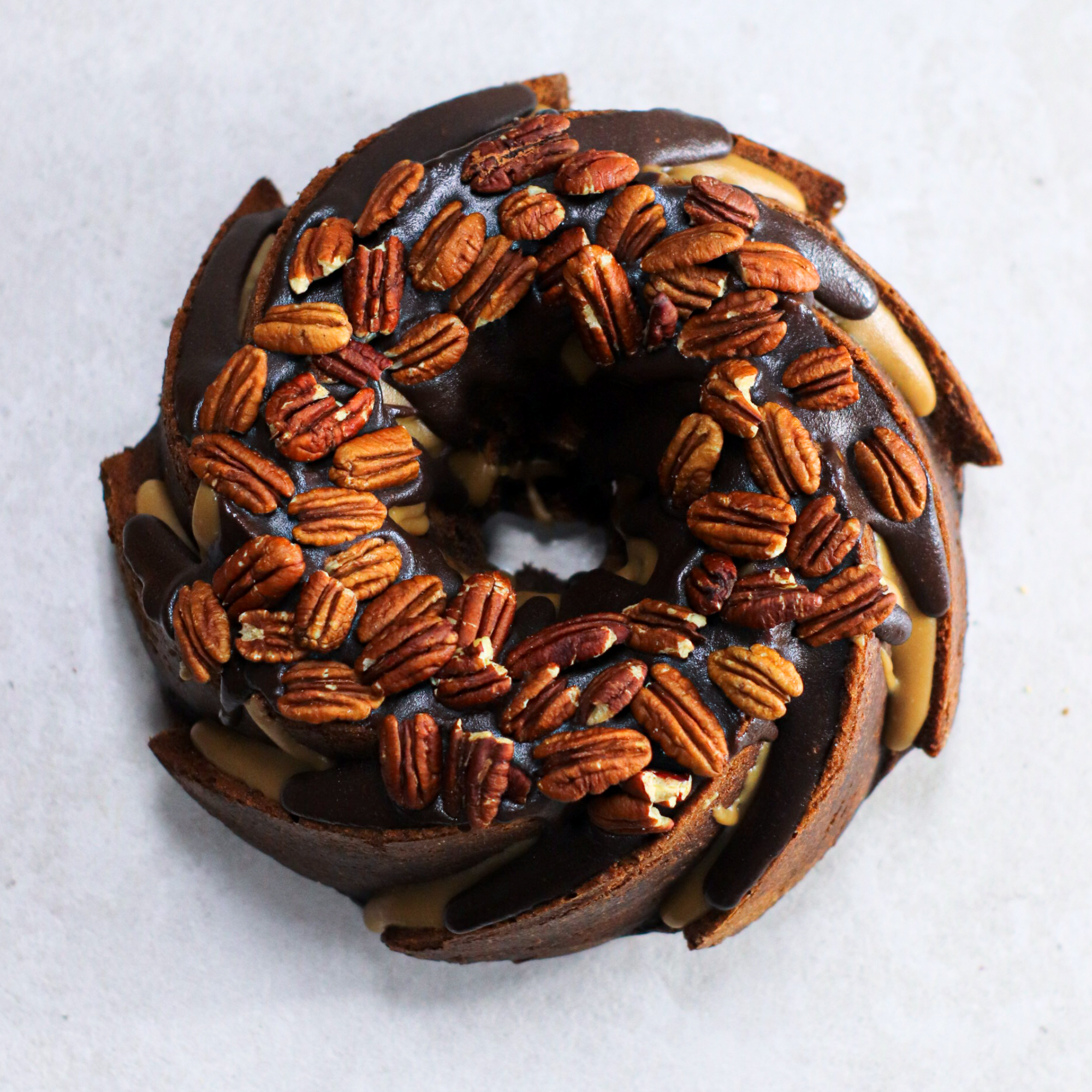 Chocolate Turtle Bundt Cake | You're guaranteed to make chocolate AND  caramel fans happy with every bite of this decadent *Chocolate Turtle Bundt  Cake!!* Get the FULL recipe here:... | By Melissa's
